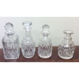 A group of four heavy glass decanters. Est. £15 -