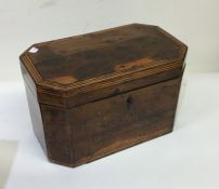 A Georgian mahogany tea caddy with crossbanded dec