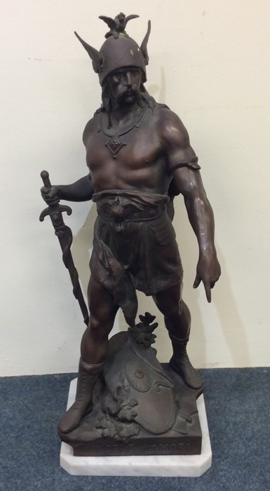 A massive spelter figure of a warrior on marble ba