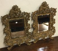 An attractive pair of large brass mounted mirrors