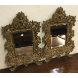 An attractive pair of large brass mounted mirrors
