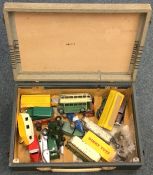 A box containing Dinky toys. Est. £20 - £30.