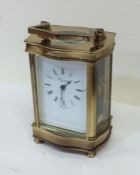 A brass mounted carriage clock. Est. £30 - £50.