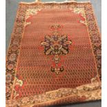 An old Oriental patterned rug. Est. £30 - £50.