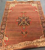 An old Oriental patterned rug. Est. £30 - £50.