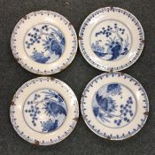 A set of four 18th Century Delft plates in blue gr