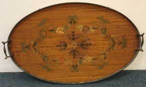 An attractive oval inlaid tray with brass gallery.