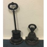 Two Victorian cast iron doorstops of tapering form