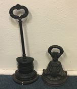 Two Victorian cast iron doorstops of tapering form