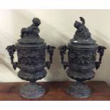 A good pair of spelter urns with lift-off covers d