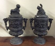 A good pair of spelter urns with lift-off covers d