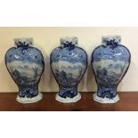 A garniture of three Delft vases decorated with sa