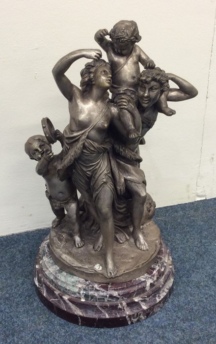 A good circular silvered bronze group of figures o