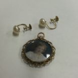 A small gold mounted locket together with ear stud