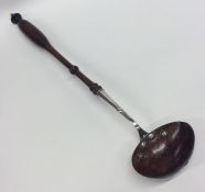 A silver and treen ladle with turned handle. Appro