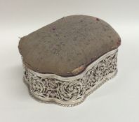 A large silver pin cushion / jewellery box with sh