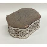 A large silver pin cushion / jewellery box with sh