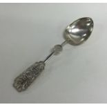 A Chinese silver teaspoon with pierced decoration.