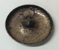 A circular silver pin dish mounted with a stag. Bi
