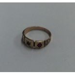 A 9 carat garnet mounted ring. Approx. 2 grams. Es