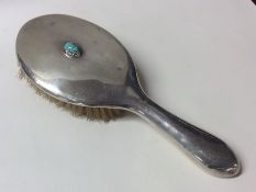 LIBERTY & CO: A silver dressing table brush mounte