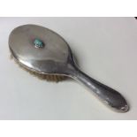 LIBERTY & CO: A silver dressing table brush mounte