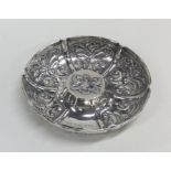A good quality embossed silver dish decorated with