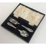 A cased silver two piece christening set. Sheffiel