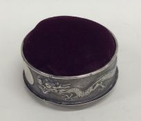 A Chinese silver pin cushion in the form of a drag