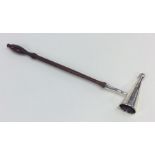 An unusual Edwardian silver candle snuffer with tu