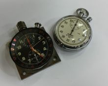 A Heuer aircraft dial together with a stopwatch. E