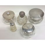 A group of five silver mounted bottles. Various da