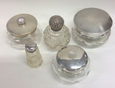 A group of five silver mounted bottles. Various da