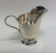 A small silver Adams' style cream jug. Birmingham.