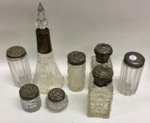 A collection of silver mounted hobnail cut jars. V