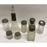 A collection of silver mounted hobnail cut jars. V