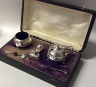 A cased silver three piece cruet. Birmingham. Appr