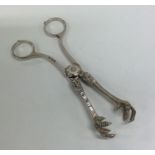 A pair of Continental silver plated ice tongs. Est
