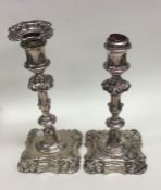 A pair of Victorian silver candlesticks with shape