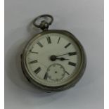 A silver open faced pocket watch with white enamel