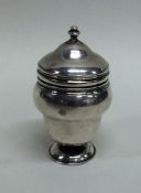 A rare urn shaped silver nutmeg grater. London. By
