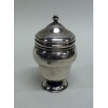 A rare urn shaped silver nutmeg grater. London. By