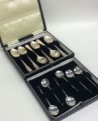 Two cased sets of silver spoons. Approx. 140