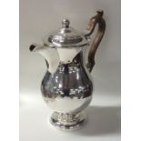 A massive silver George III ale jug with crested f