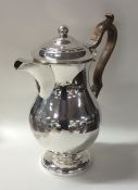 A massive silver George III ale jug with crested f