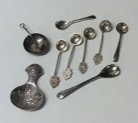 A bag containing silver caddy spoons, salt spoons