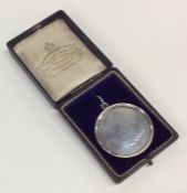 A cased Victorian silver medallion dated '1848'. A