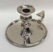 A Georgian silver chamber stick with reeded border