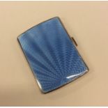 A silver and enamel cigarette case with hinged top