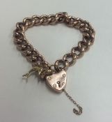A 9 carat curb link child bracelet. Approx. 16 gra